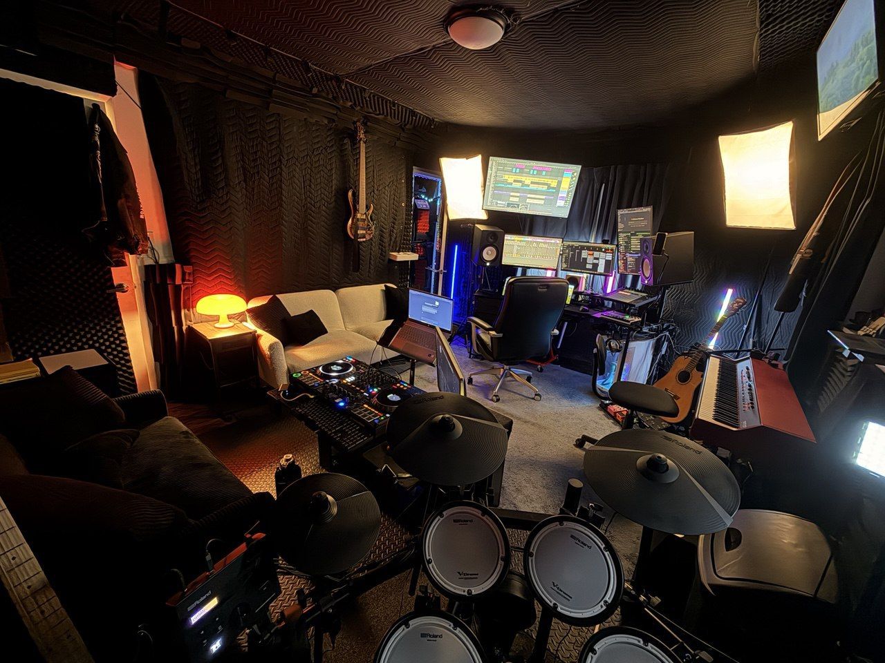 Roland V-Drums view looking toward DAW desk, couch, mushroom lamp, softbox lights